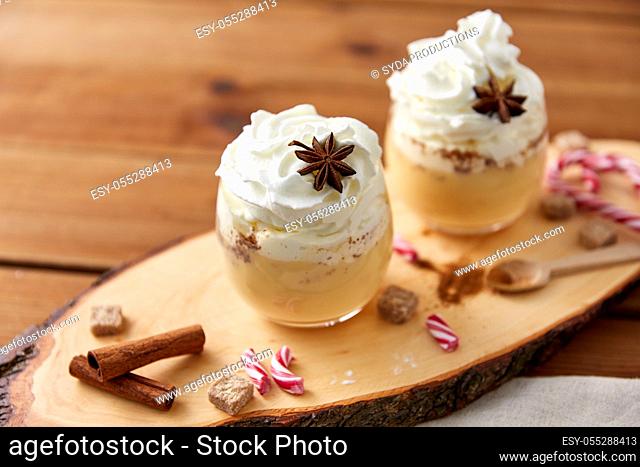 glasses of eggnog with whipped cream and anise