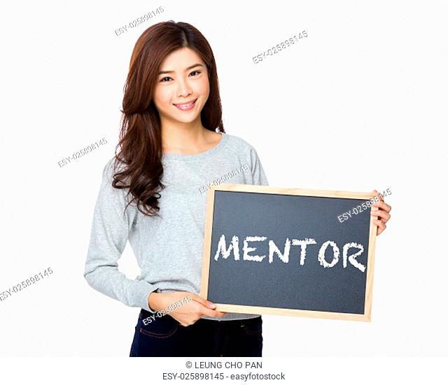Asian woman hold with black board and showing a word mentor