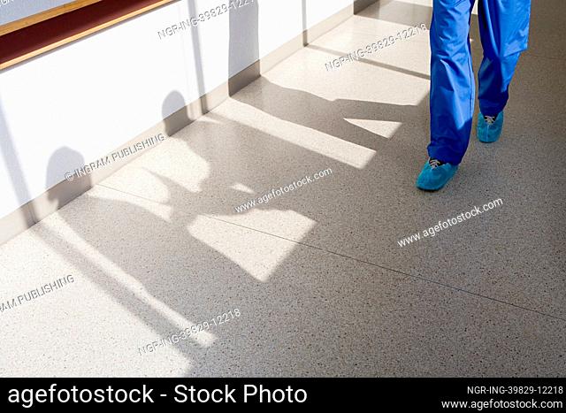 Surgeon walking down corridor