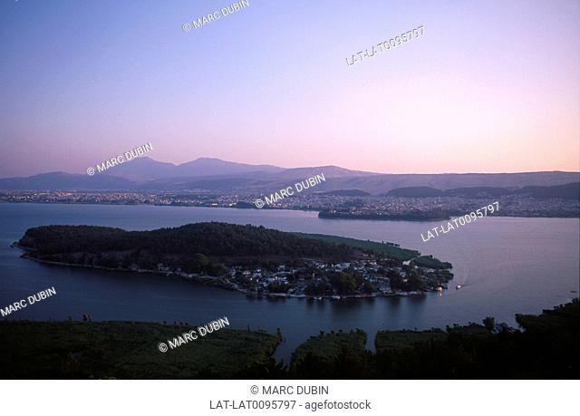 Aegean. Pindhos mountains. Pamvotis lake. Island. Sunset. Pink sky