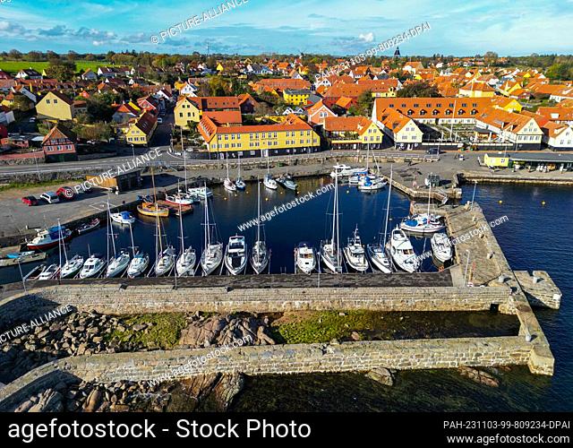 24 October 2023, Denmark, Svaneke: Town view of Svaneke, a small town on the north-eastern edge of the Danish island of Bornholm in the Baltic Sea (aerial view...