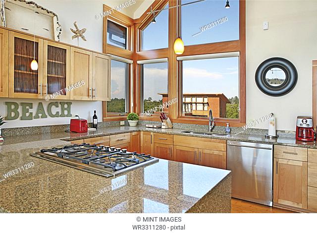 Countertops and windows in modern kitchen