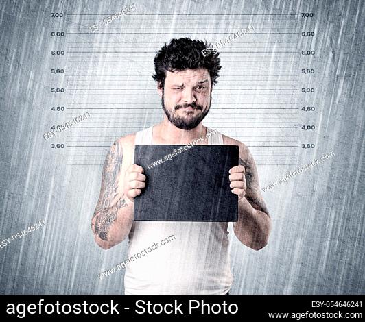 Gangster with rainy, lowering background and table on his hand