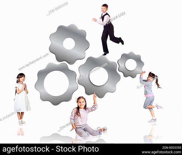 Children beside metal gears isolated on the white background