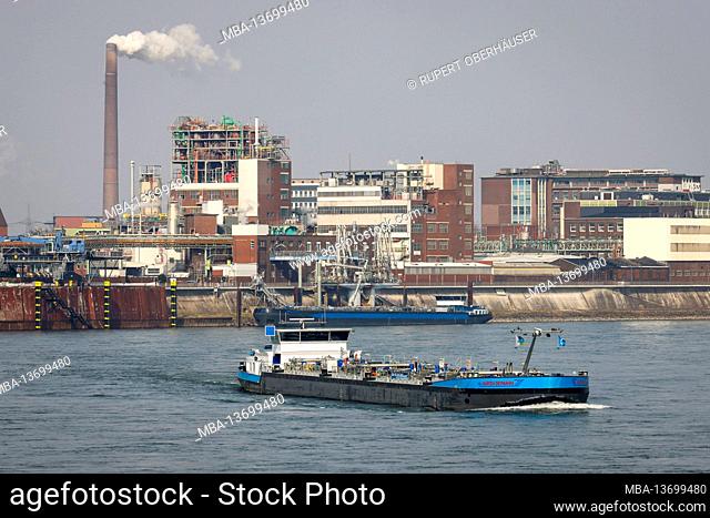 Krefeld, North Rhine-Westphalia, Germany - Tanker sails on the Rhine past the Chempark Krefeld Urdingen chemical plant at the Krefeld port