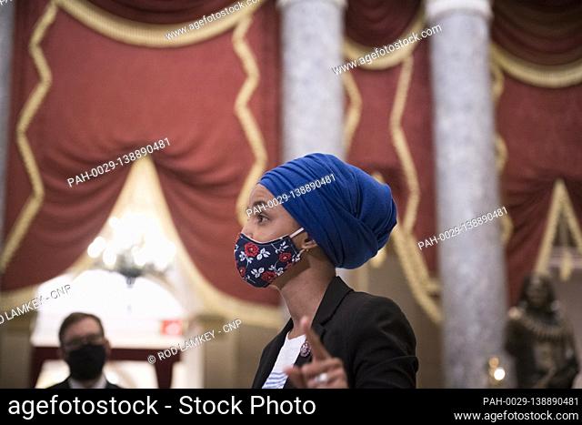 United States Representative Ilhan Omar (Democrat of Minnesota) talks with reporters in Statuary Hall as the House votes on H. Res