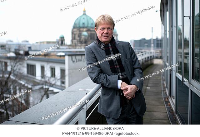 16 December 2019, Berlin: Reiner Hoffmann, chairman of the German Confederation of Trade Unions (DGB), is standing in front of an interview with the German...