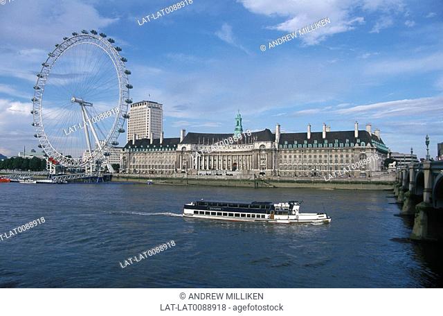 County Hall, hotel, London Aquarium building. London Eye ferris wheel. Barge. River Thames
