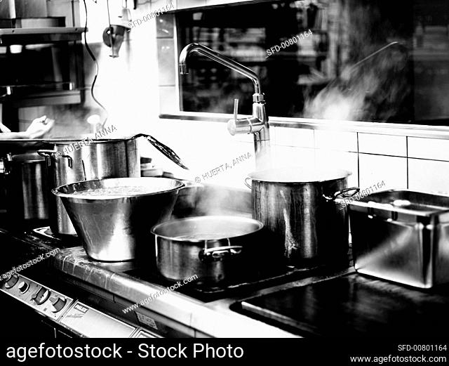 Steaming pots in a restaurant kitchen