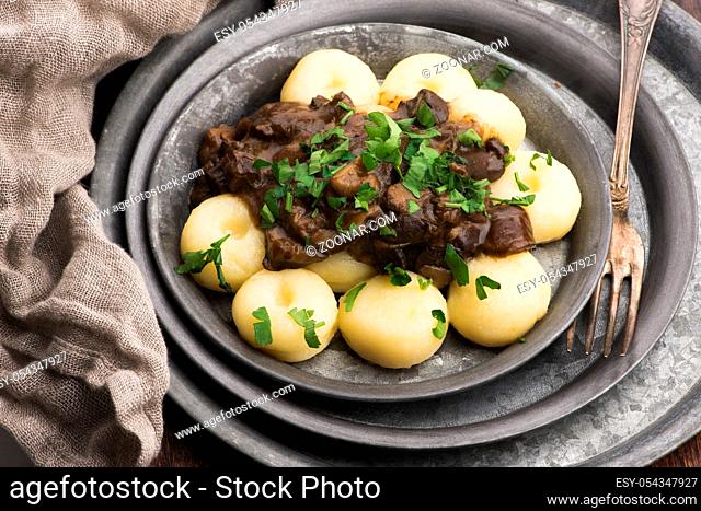 Potato dumplings and forest mushroom sauce