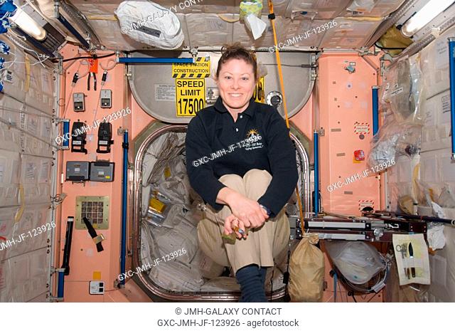 Inside the Unity node, NASA astronaut Tracy Caldwell Dyson, Expedition 23 flight engineer, goes through some acrobatics that would be impossible in Earth...