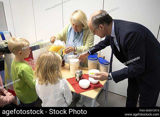Students having breakfast, Dr. Urban MAUER, Secretary of State in the Ministry of Schools and Education of the State of North Rhine-Westphalia, pours muesli