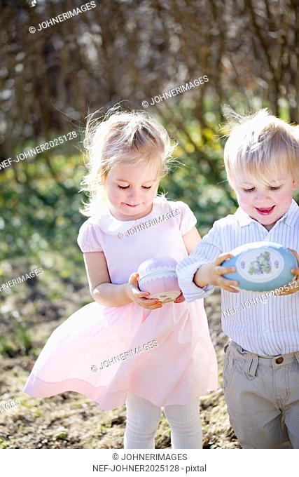 Boy and girl with Easter eggs