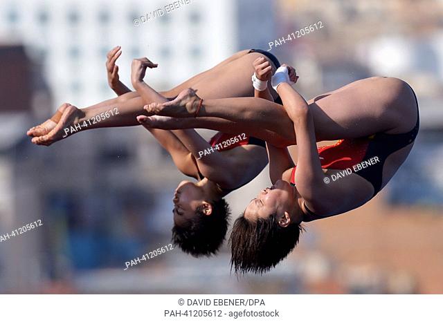 Huixia Liu and Ruolin Chen of China in action during the women's 10m Synchro Platform diving final of the 15th FINA Swimming World Championships at Montjuic...