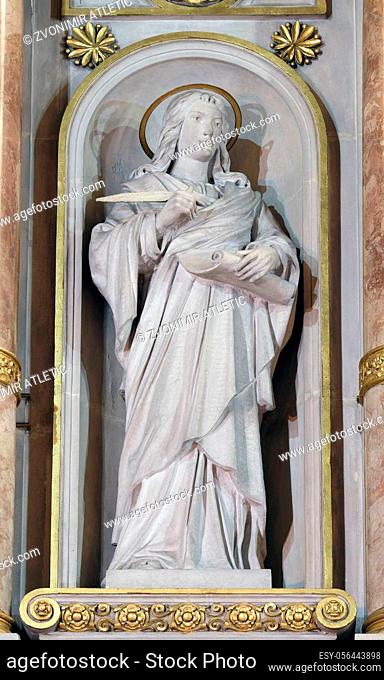 St. John the Evangelist statue on the main altar in Basilica of the Sacred Heart of Jesus in Zagreb, Croatia