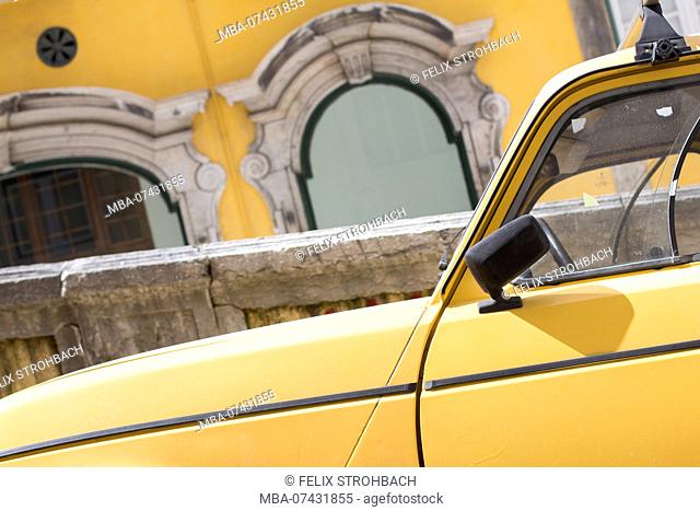 Detail shots from the colorful streets of Lisbon, yellow car in front of yellow house wall