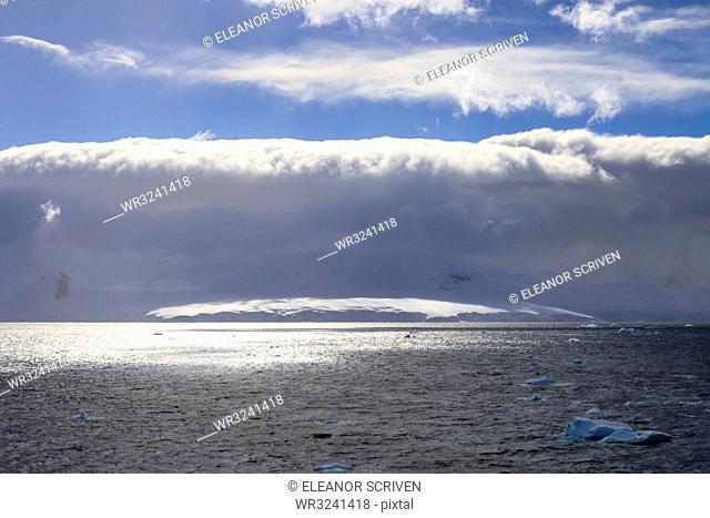 Arcus cloud over the mountains of the Gerlache Strait, blue sky, Antarctic Peninsula, Antarctica, Polar Regions