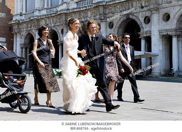 Bridal couple and wedding party on Piazza dei Signori Square, Vicenza, Veneto, Italy, Europe