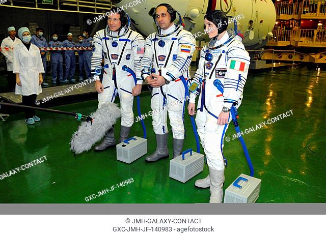 In the Integration Facility at the Baikonur Cosmodrome in Kazakhstan, Expedition 4243 crewmembers Terry Virts of NASA (left)