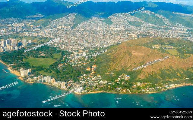 aerial tracking shot of diamond head and waikiki from an airplane