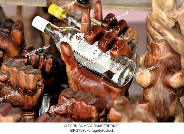 Rack for rum bottles, hands carved of wood, souvenirs, market stall, Trinidad, Cuba, Greater Antilles, Caribbean, Central America, America