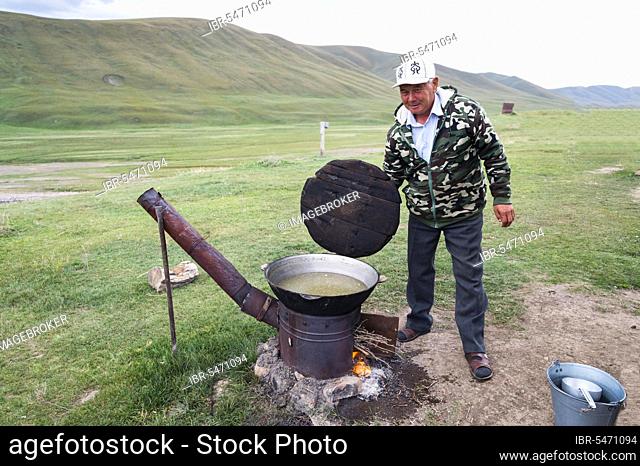 Kazakh nomads preparing noodles, Ile-Alatau National Park, Assy Plateau, Almaty, Kazakhstan, Central Asia, Asia