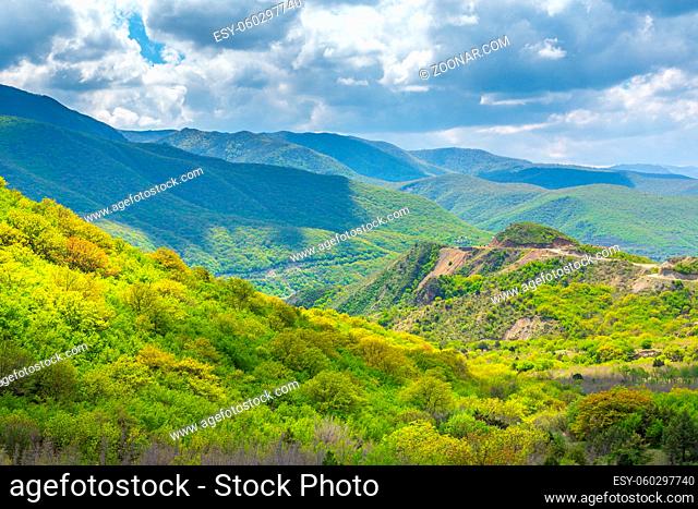 Green caucasus mountain landscape and road in Georgia, natural travel vacation background