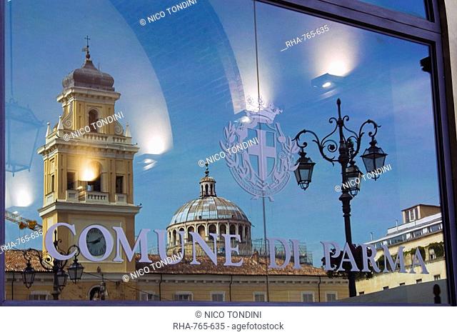 Piazza Garibaldi reflected in the glass of the Town Hall, Parma, Emilia Romagna, Italy, Europe