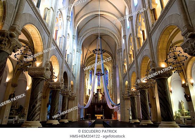 France, Hautes Pyrenees, Lourdes, inside Sacred Heart Parish Church which shelters Bernadette Soubirous' baptismal font and Mr Peyramale's tomb Lourdes Priest