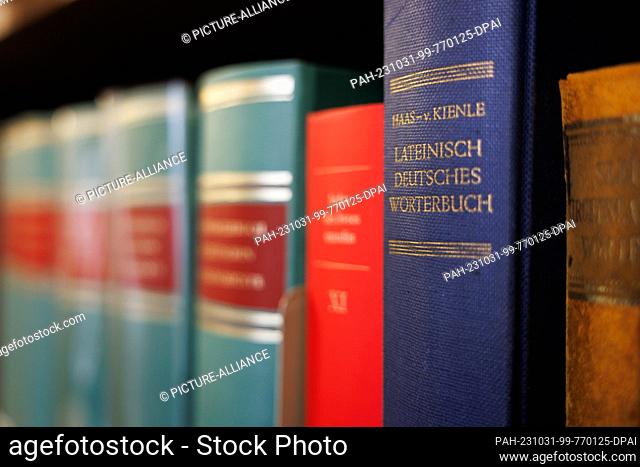 PRODUCTION - 20 October 2023, Lower Saxony, Osnabrück: View of a book titled ""Latin German Dictionary"" in a room of the Osnabrück Diocesan Library