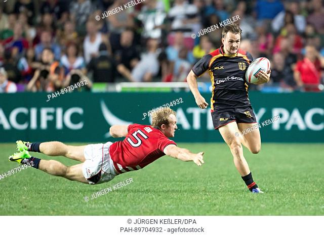 Toby Fenn (Hongkong, 5) and Bastian Himmer (Deutschland, 10) in action during the men's Rugby Sevens qualification tournament quarterfinals match between...