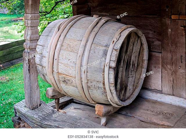 Old wooden wine barrel at the shed in Ukrainian village