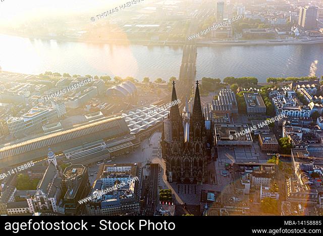 cologne cathedral and hohenzollernbrücke over the rhine - captured via zeppelin in the early morning just after sunrise. andreas-viertel (andreas district)