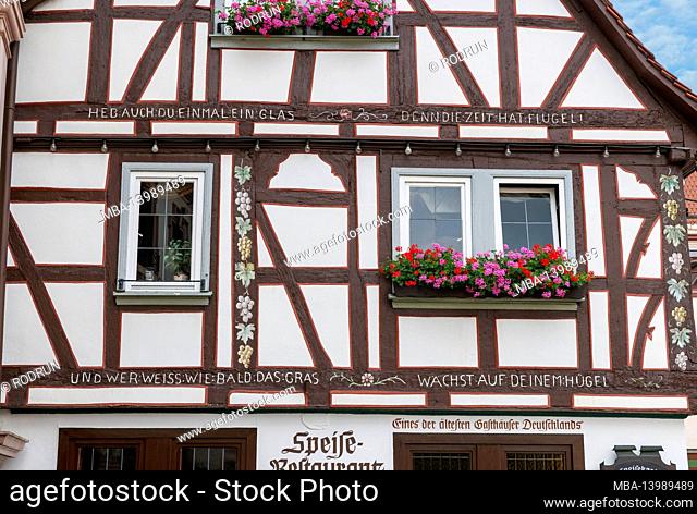 Germany, Hessen, Erbach, half-timbered house, toast at the Gasthaus zum Hirsch one of the oldest inns in Germany. Toast: You too should raise a glass