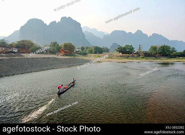 Horizontal view of activities on the Nam Song river in Vang Vieng, Laos