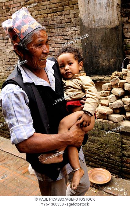 grandfather with grandson , street life, kathmandu, nepal