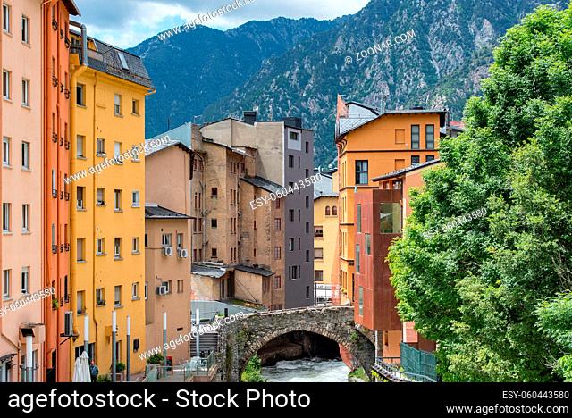 ESCALDES-ENGORDANY, ANDORRA - 2020 juny 8: River Valira on Engordany Bridge and houses view in a snowfall day in small town Escaldes-Engordany in Andorra on...