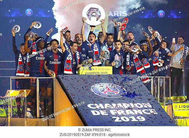 Paris Saint-Germain's players celebrate with their champion's trophy at the end of the French L1 football match between Paris Saint-Germain (PSG) and Dijon at...