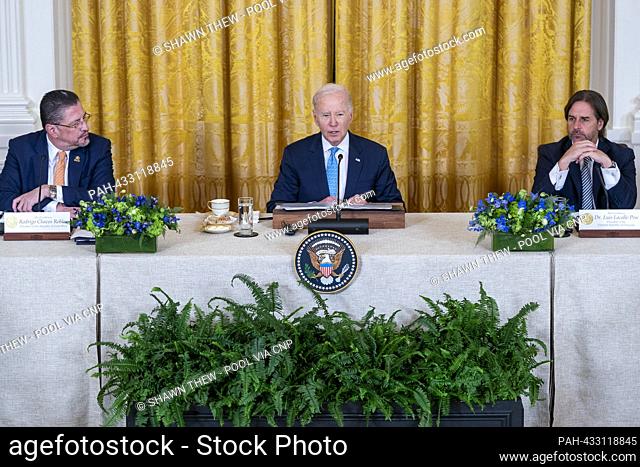 United States President Joe Biden, with President of Costa Rica Rodrigo Chaves Robles (L) and President of Uruguay Luis Lacalle Pou (R)