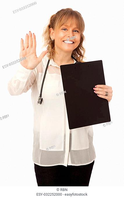 A good looking female doctor wearing a white shirt and black pants, holding a clipboard with a stethoscope around her neck. White background