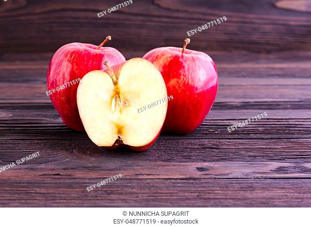 Red Apples on wooden table