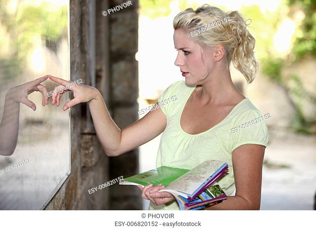 Blond woman looking at a map