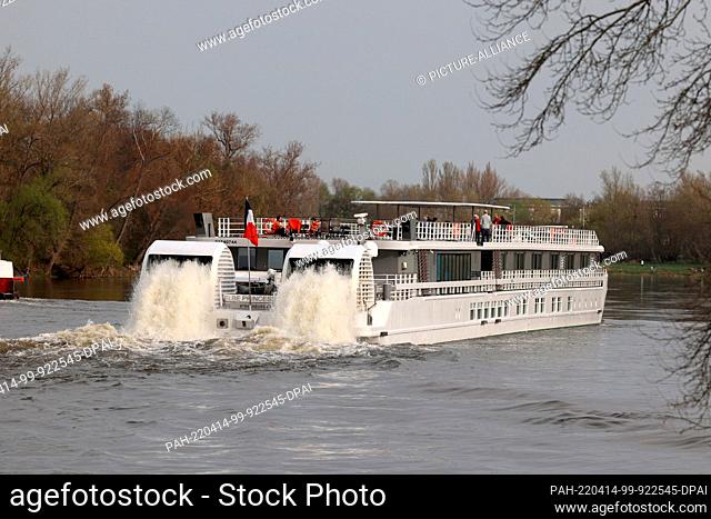 14 April 2022, Saxony-Anhalt, Magdeburg: The paddlewheel river cruise ship ""Elbe Princesse"" travels upstream the city route on the Elbe