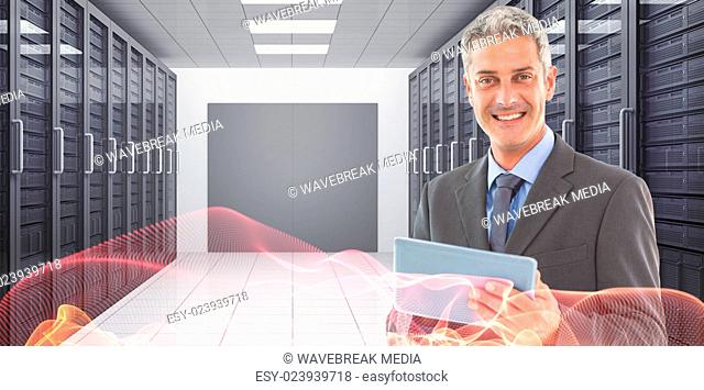 Composite image of happy businessman using tablet pc