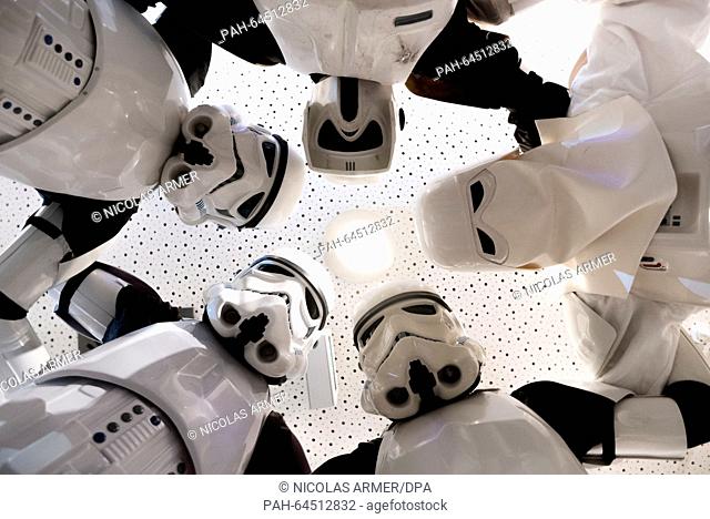 Members of 'Star Wars Fans Nuremberg e.V.' wearing Stormtroopers costumes pose in a cinema in Nuremberg,  Germany, 16 December 2015