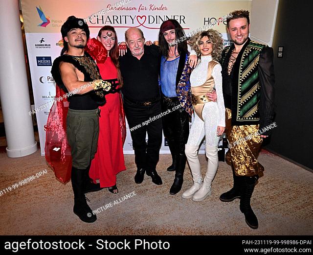 18 November 2023, Bavaria, Munich: The composer Ralph Siegel (m) appears with the group Dschinghis Khan at the charity dinner ""Together for Children"" at the...