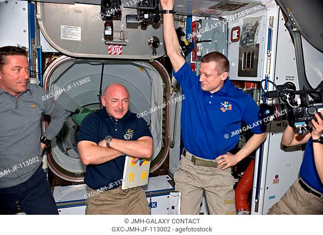 STS-134 and Expedition 27 crew members are pictured in the Harmony node of the International Space Station shortly after space shuttle Endeavour and the space...