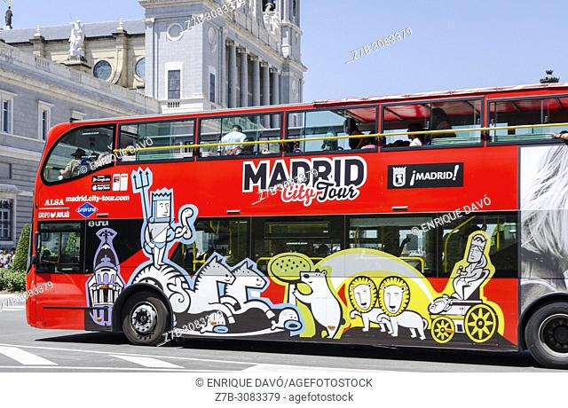 A touristic red bus view close to Palacio de Oriente. Madrid, Spain