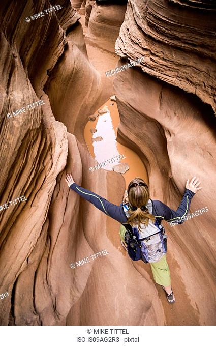 Woman hiking Little Wildhorse Canyon in the San Rafael Swell, Utah, USA