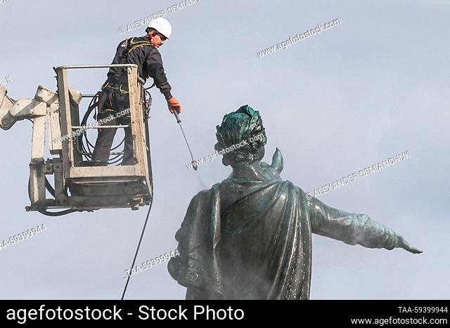 RUSSIA, ST PETERSBURG - MAY 26, 2023: A utility worker washes the Bronze Horseman, an equestrian statue of Peter the Great by French sculptor Etienne Maurice...